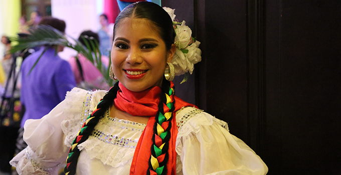 Photo of a woman dressed in a festival costume.